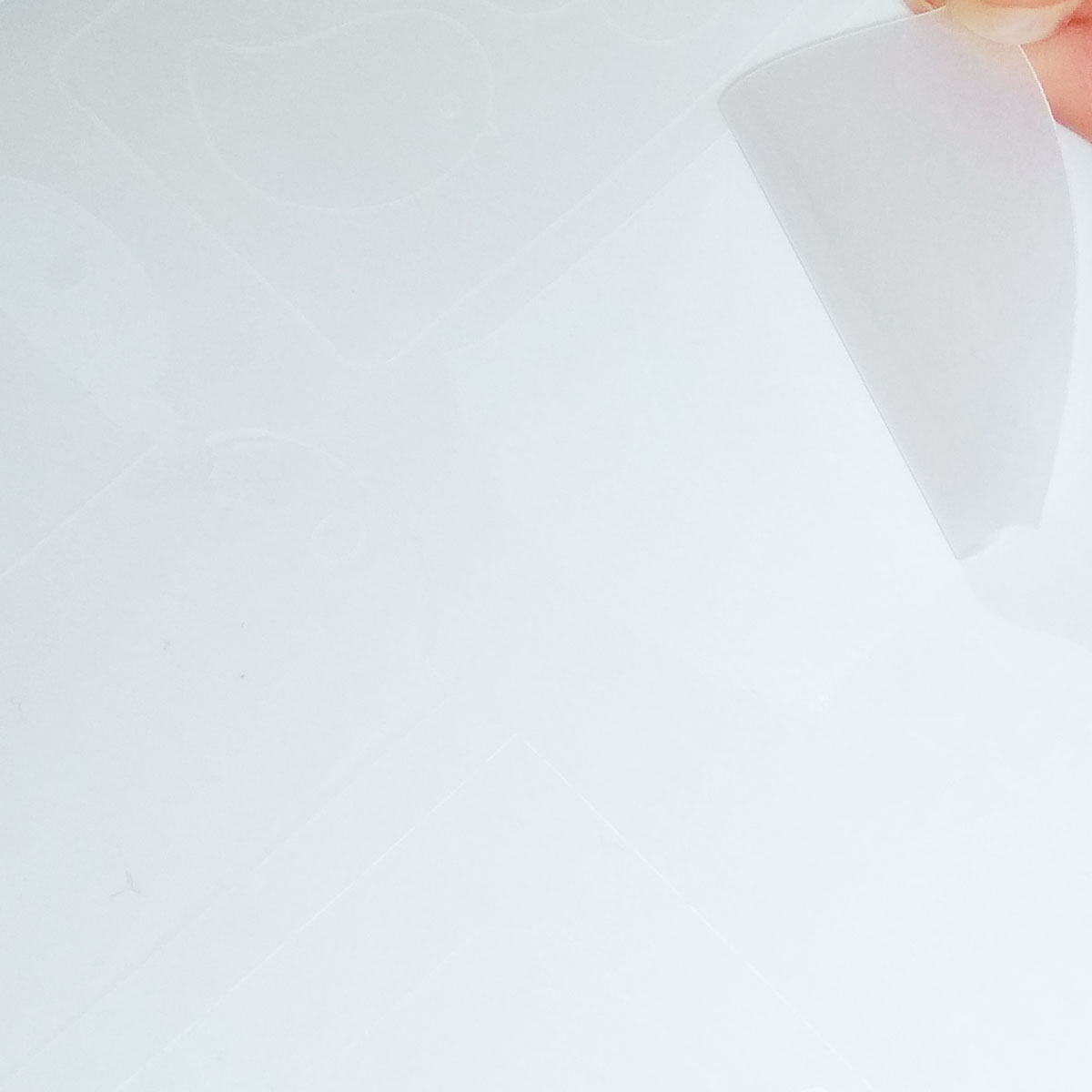 Self-adhesive translucent paper for laser printers and copiers