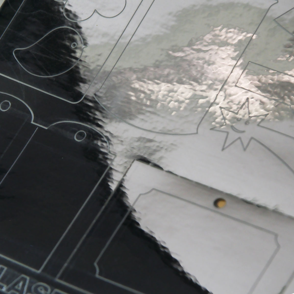 Self-adhesive. polyester film for laser printers and copiers