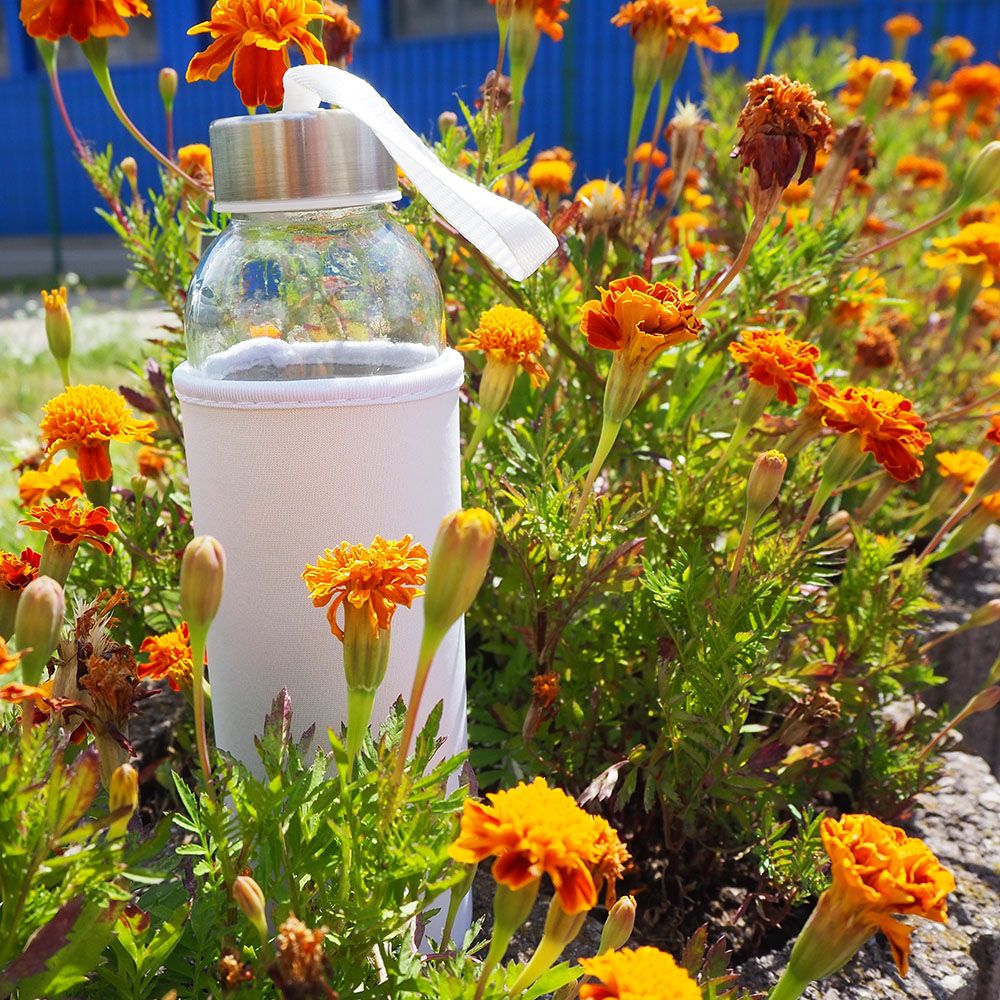 Glass bottle with a cover