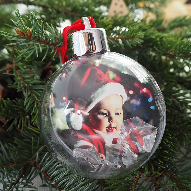 Photo Christmas bauble with red ribbon and silver cap