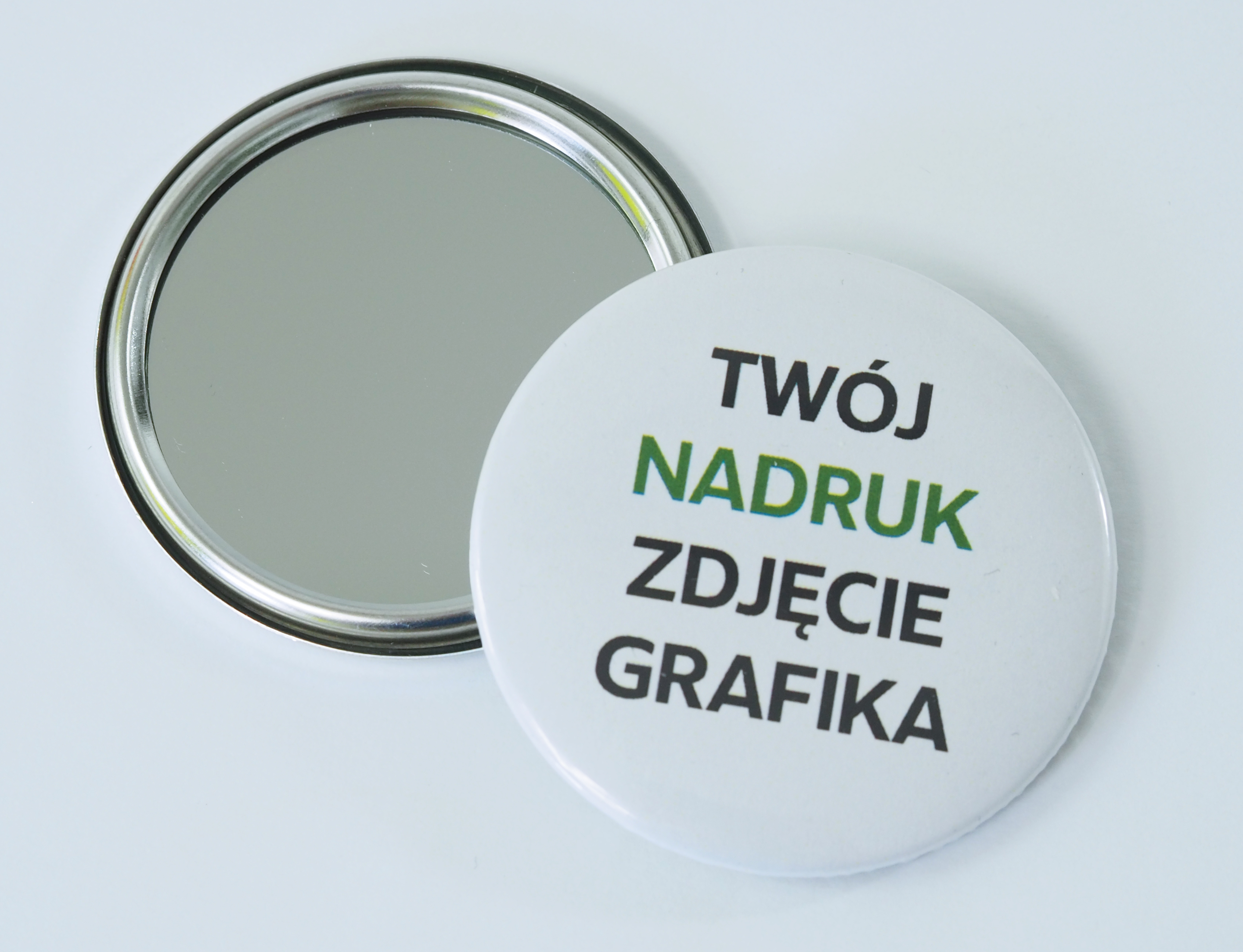 Elements for making badges with a mirror
